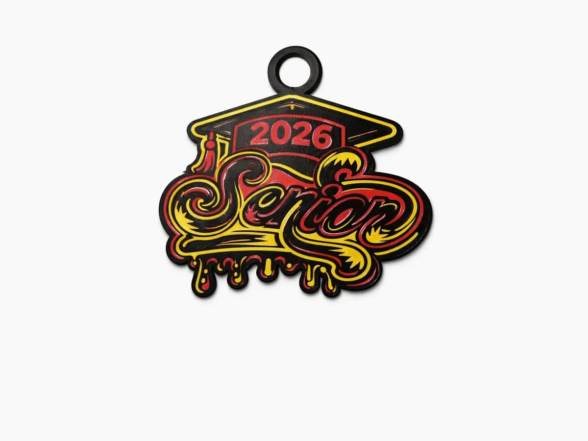Class of 2026 senior medallion with flame lettering