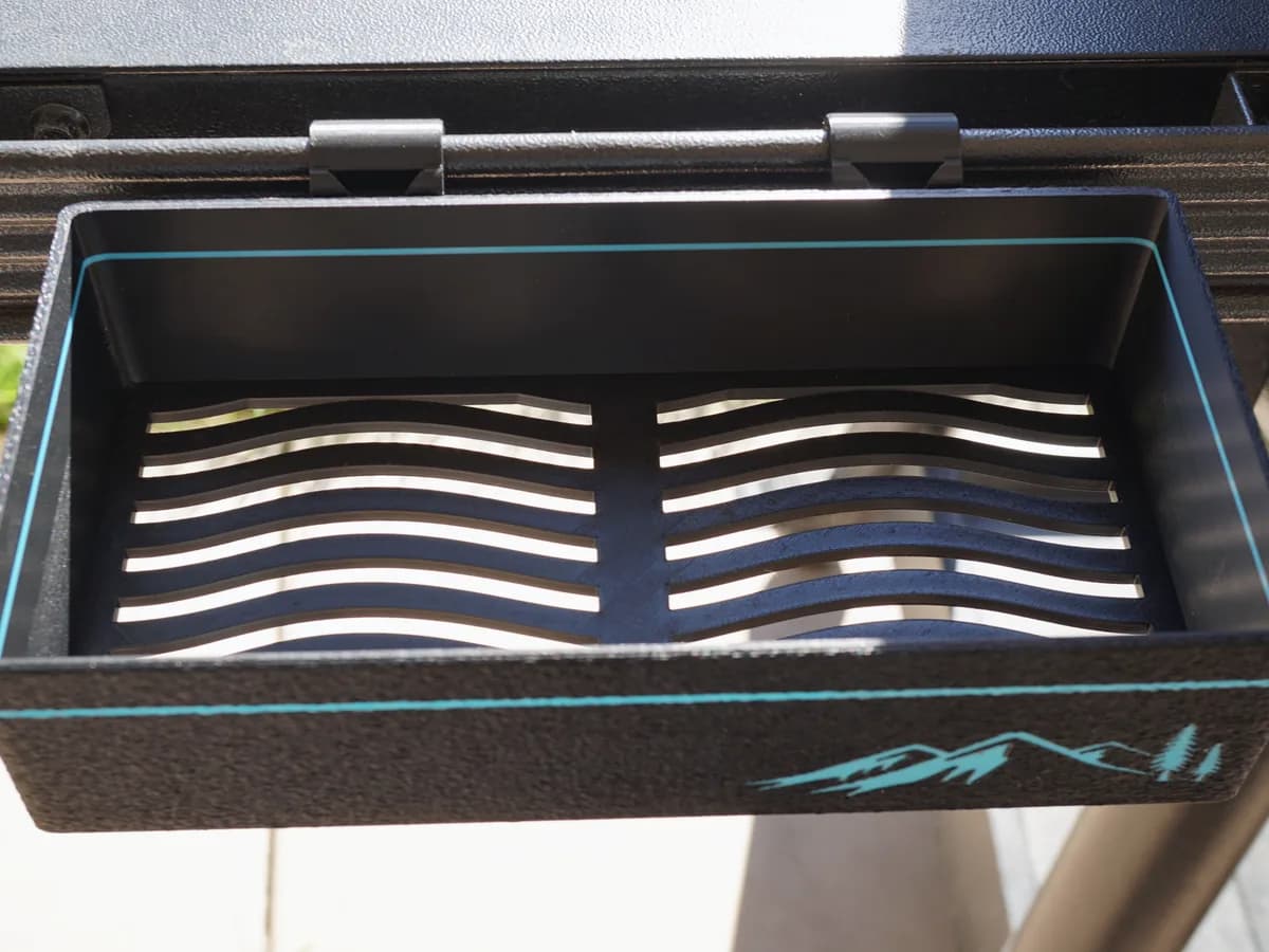 Slotted printed grill tray with the mountain graphic