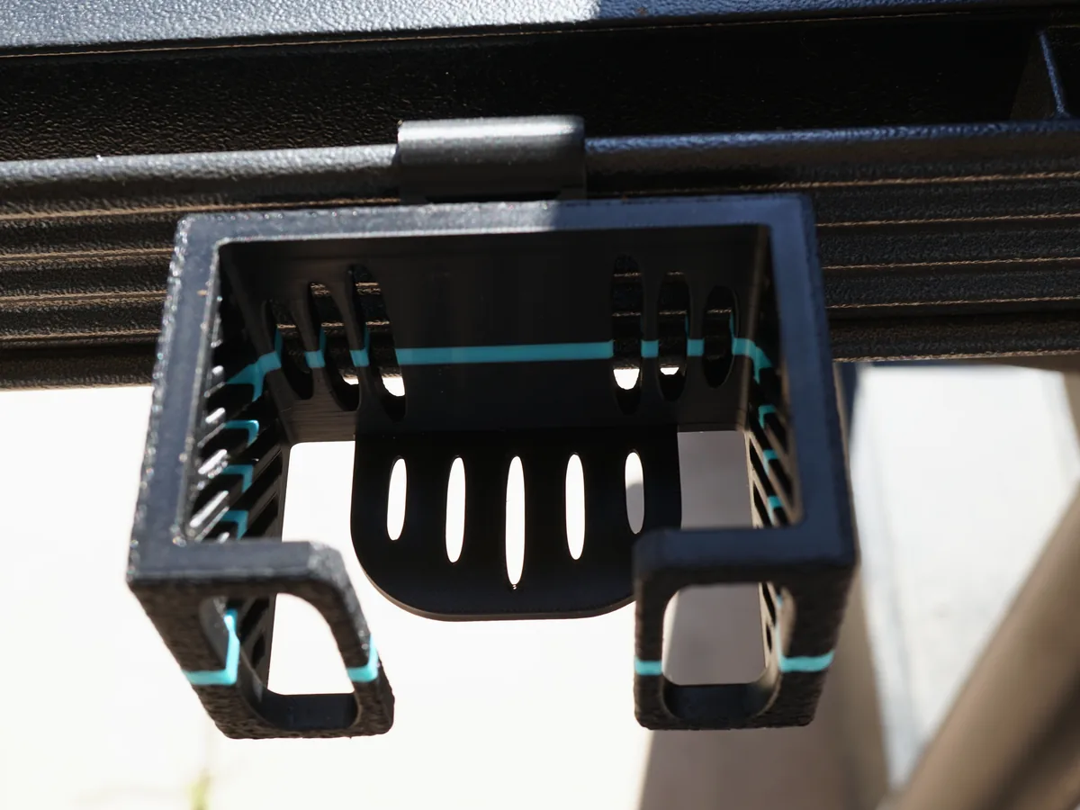 Printed utensil holder clipped to a grill rail