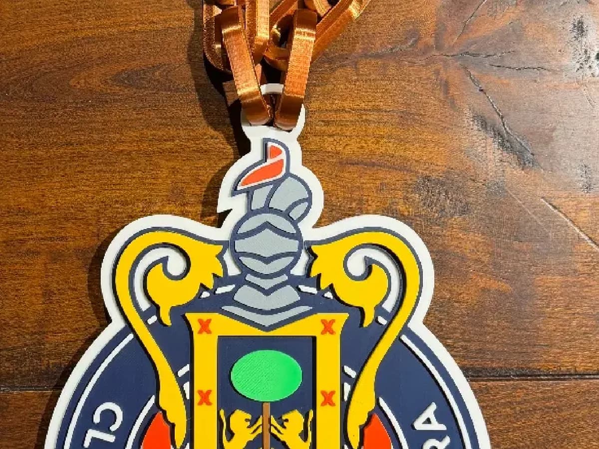 Club Deportivo Guadalajara crest chain on a wooden table