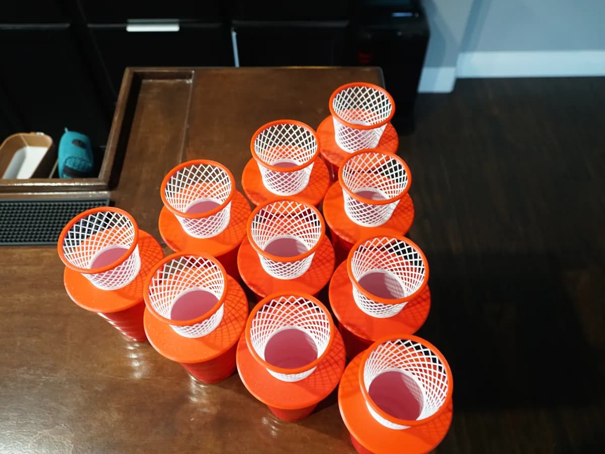 Orange mini basketball hoop cups arranged in a group