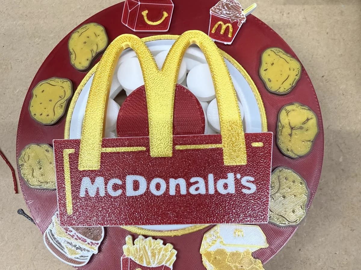 Layered McDonald's themed medallion